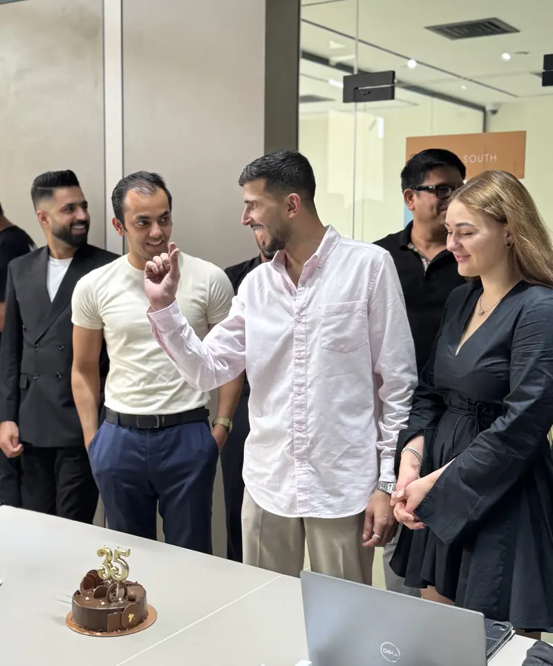 Colleagues celebrating together at the office